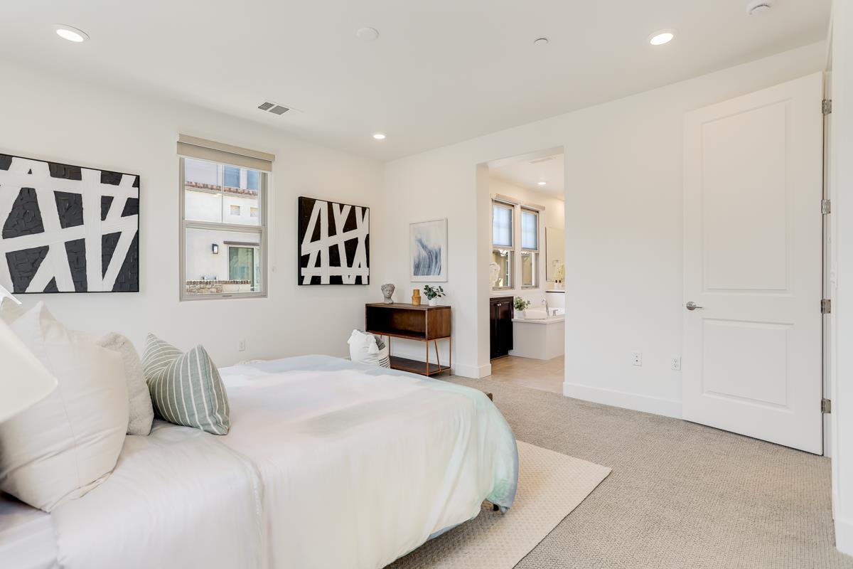 14 Catania Common Fremont, CA 94536 - Photo 18 of 39 a bedroom with a large bed and furniture