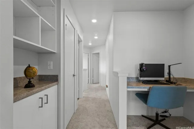 a en suite bathroom with a granite countertop sink and a mirror