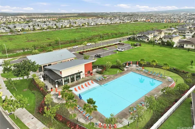 an aerial view of a residential houses with outdoor space and street view