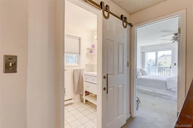 a bathroom with a shower and a toilet