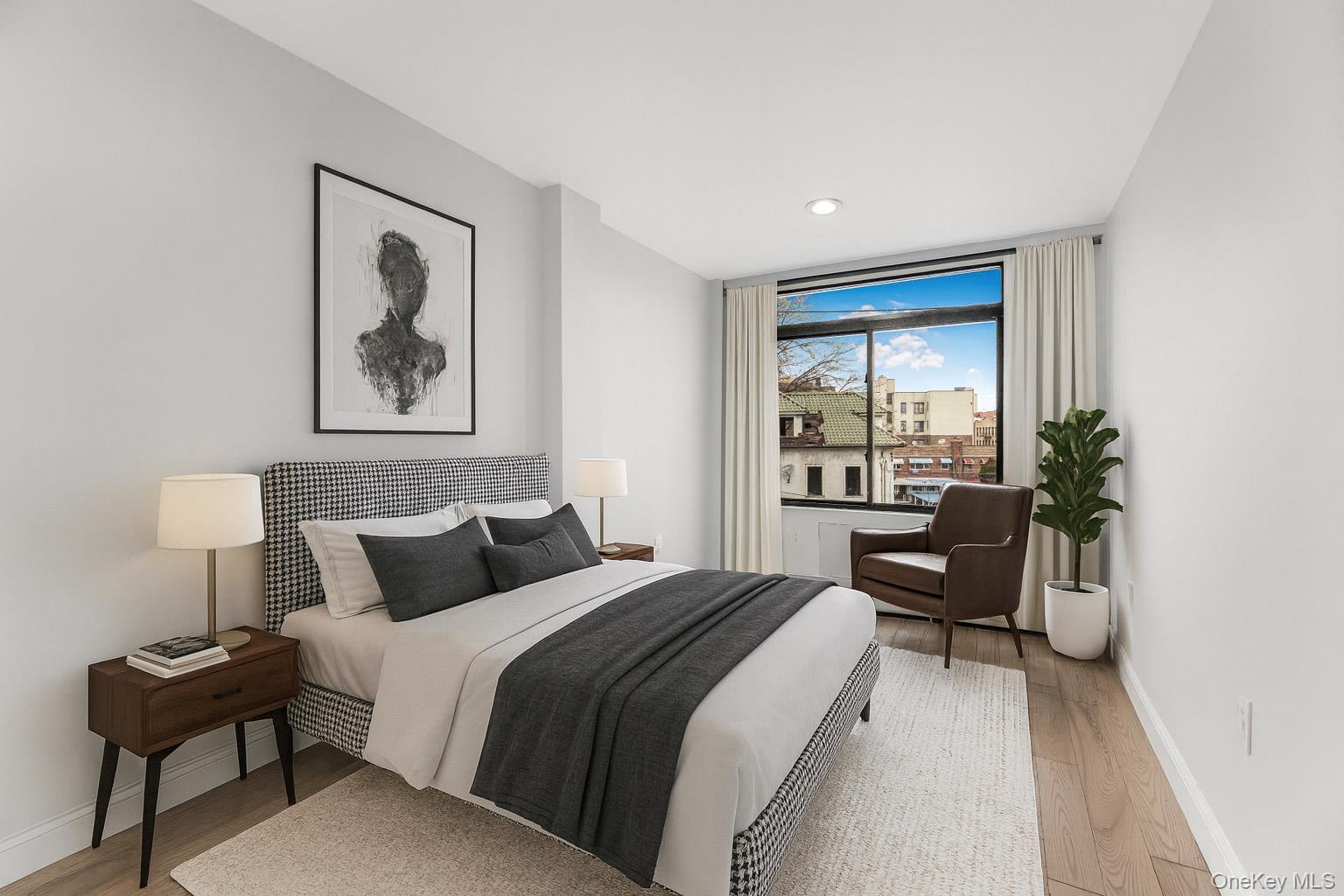 3067 Williamsbridge Road Bronx, NY 10467 - Photo 10 of 29 a bedroom with a bed and a large window