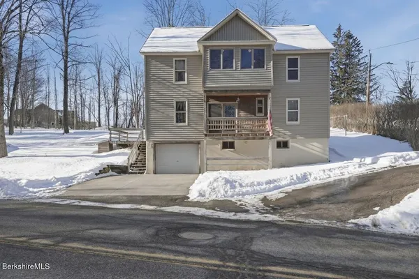 a front view of a house with entertaining space
