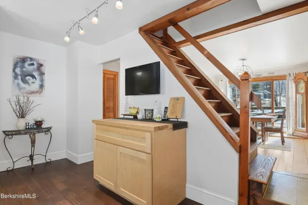 a kitchen that has a lot of cabinets in it and appliances