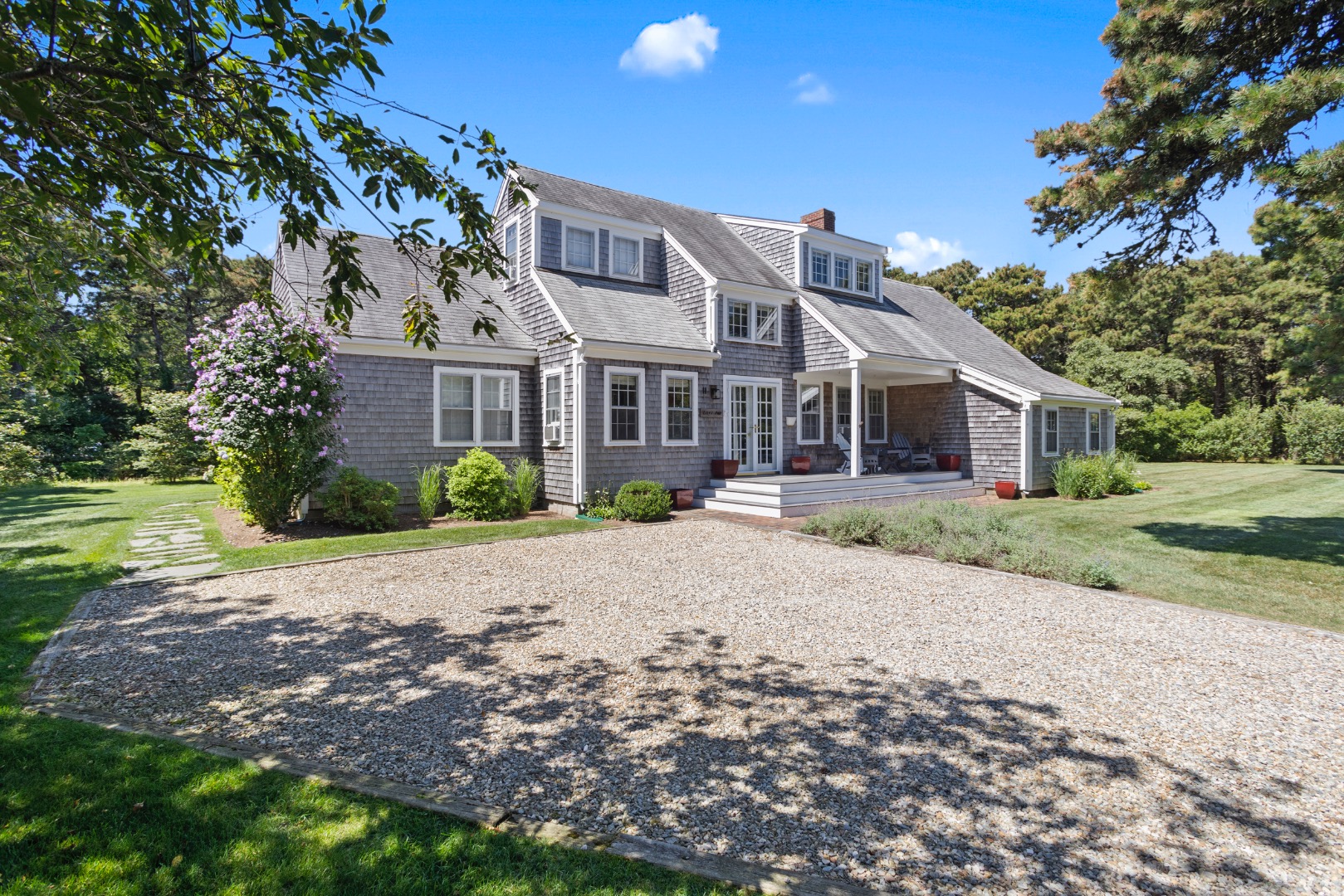 11 Sesapana Road Nantucket, MA 02554 - Photo 2 of 37 a front view of house with yard and green space