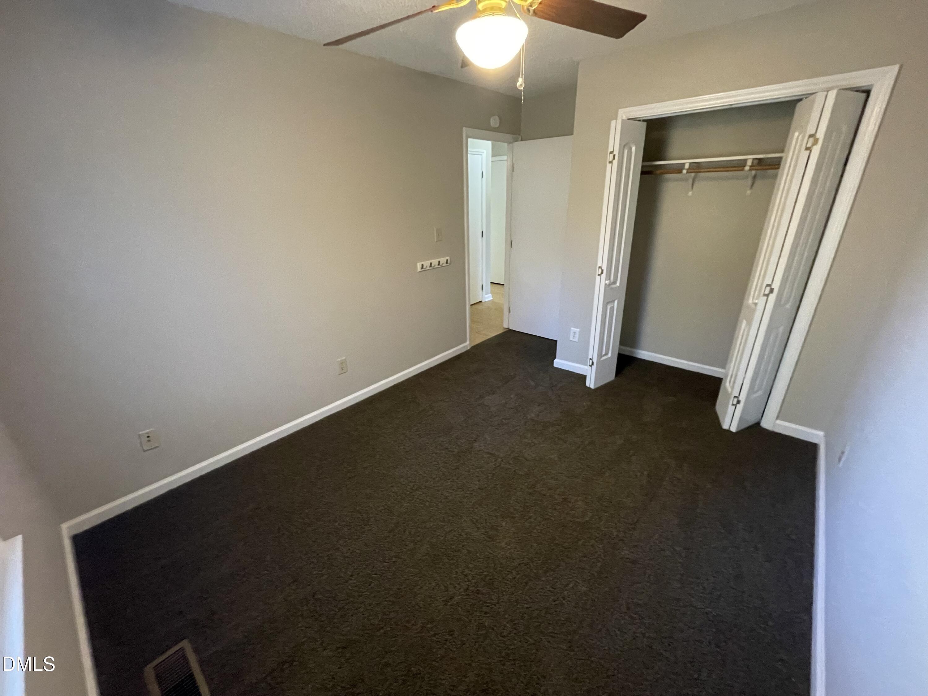 4116 Lodge Allen Court Raleigh, NC 27616 - Photo 16 of 20 an empty room with a door