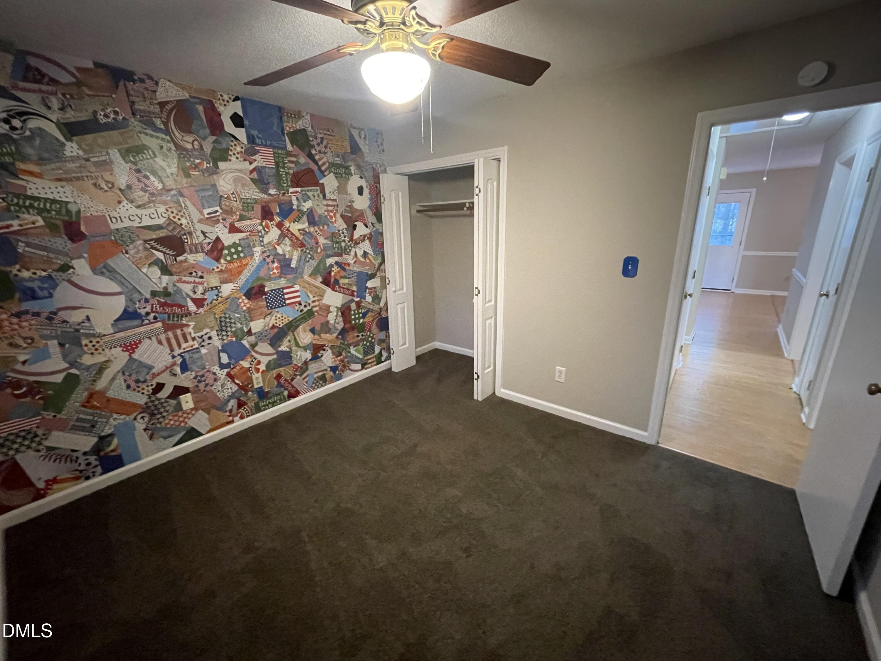 4116 Lodge Allen Court Raleigh, NC 27616 - Photo 18 of 20 en empty room with windows and ceiling fan