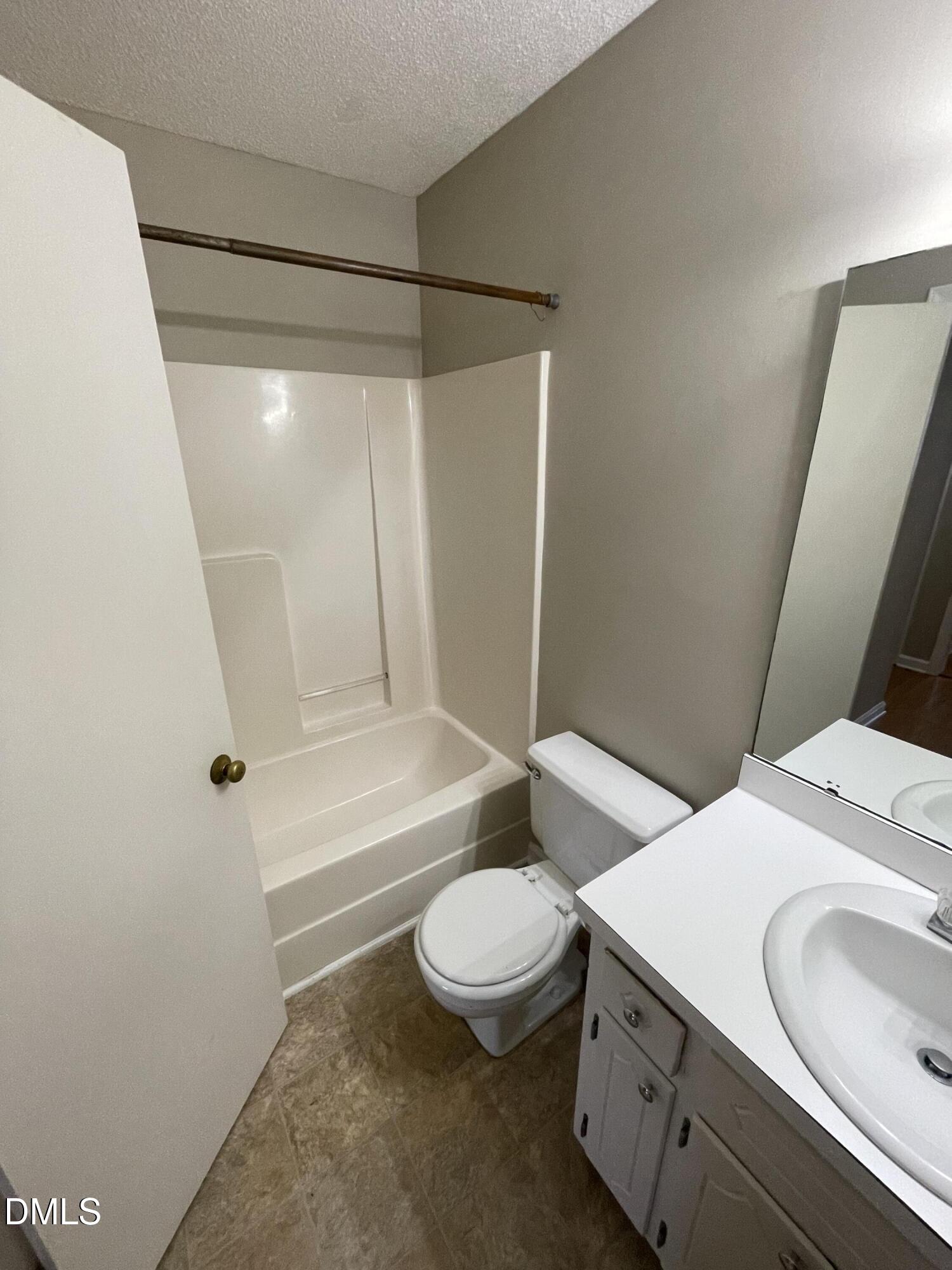 4116 Lodge Allen Court Raleigh, NC 27616 - Photo 20 of 20 a bathroom with a sink a toilet and shower