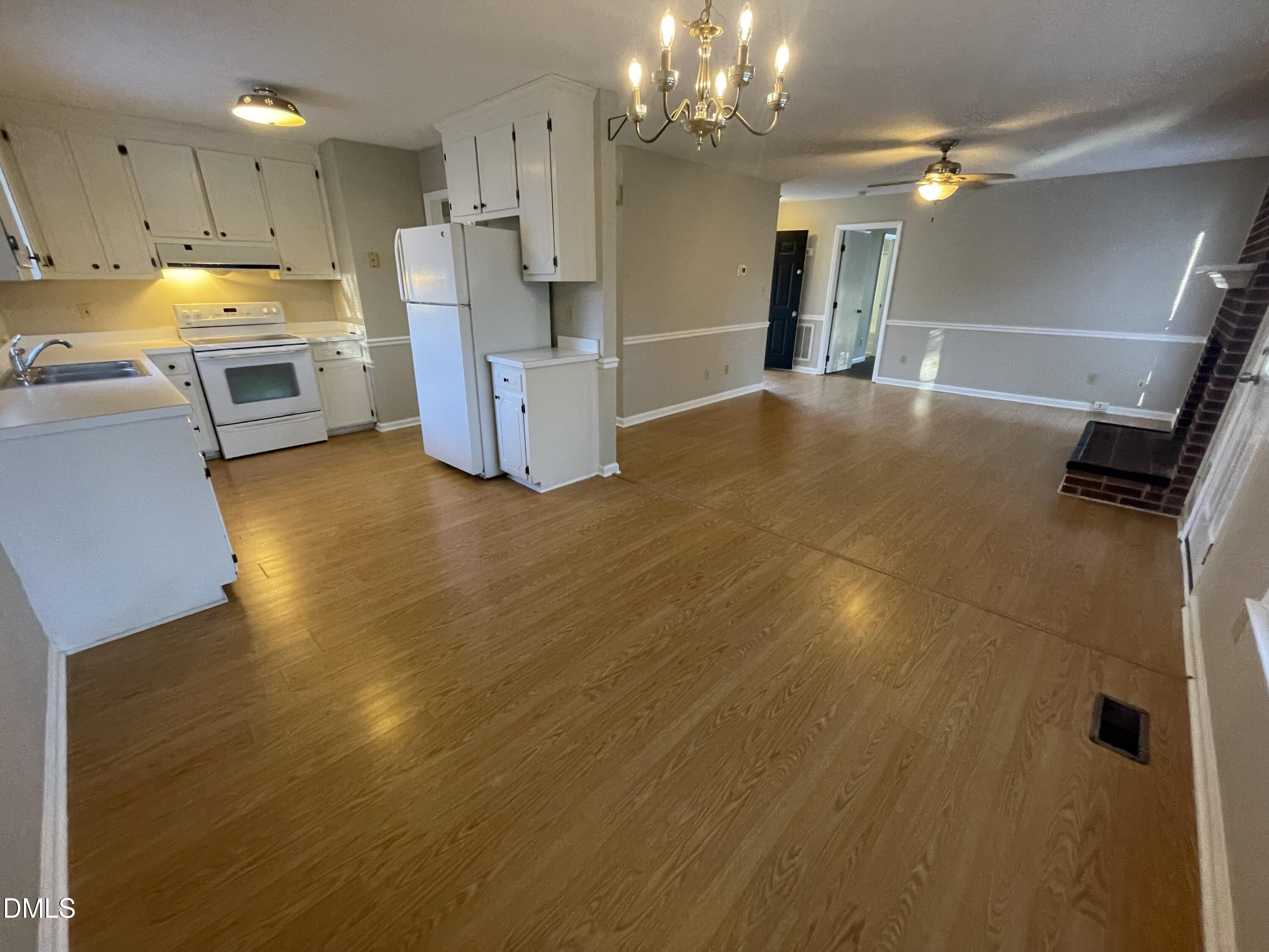 4116 Lodge Allen Court Raleigh, NC 27616 - Photo 10 of 20 a view of a kitchen with a sink a refrigerator and window