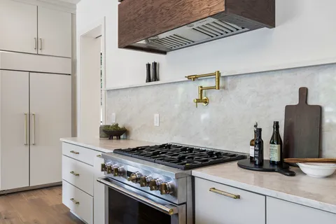 a bathroom with a double vanity sink and mirror