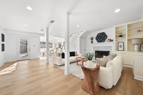 a living room with furniture a fireplace and a fireplace