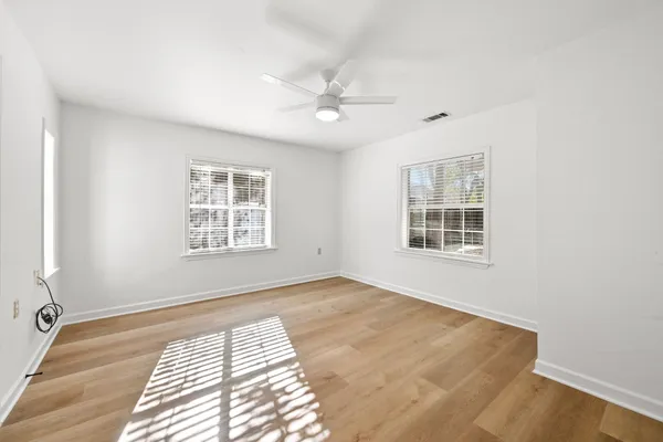 a view of an empty room with a window
