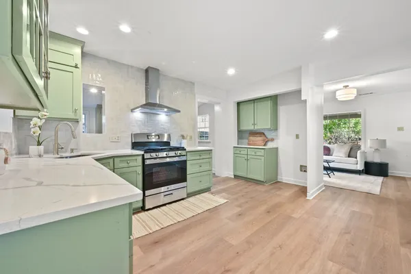 a kitchen with a stove and a sink