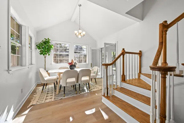 a view of a dining room with furniture window and wooden floor