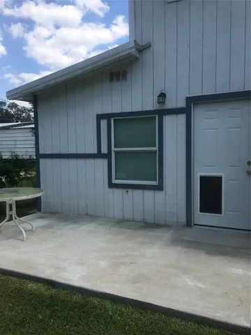 a kitchen with granite countertop a refrigerator and a stove