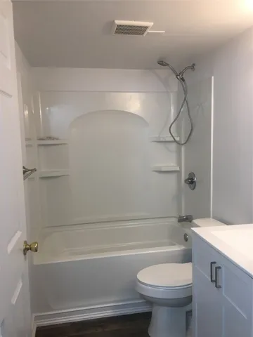 a front view of a house with parking space