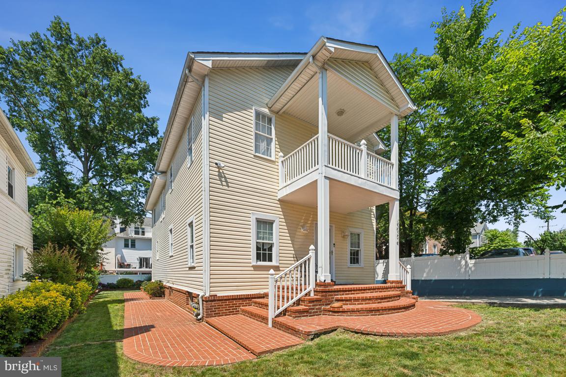 Grand entrance with patio areas all around!
