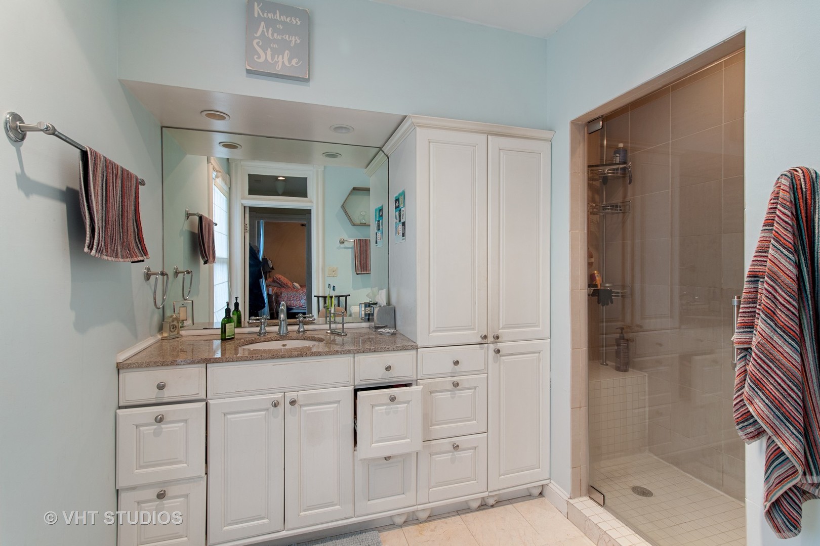 136 Scottswood Road Riverside, IL 60546 - Photo 11 of 20 a bathroom with a shower sink and mirror