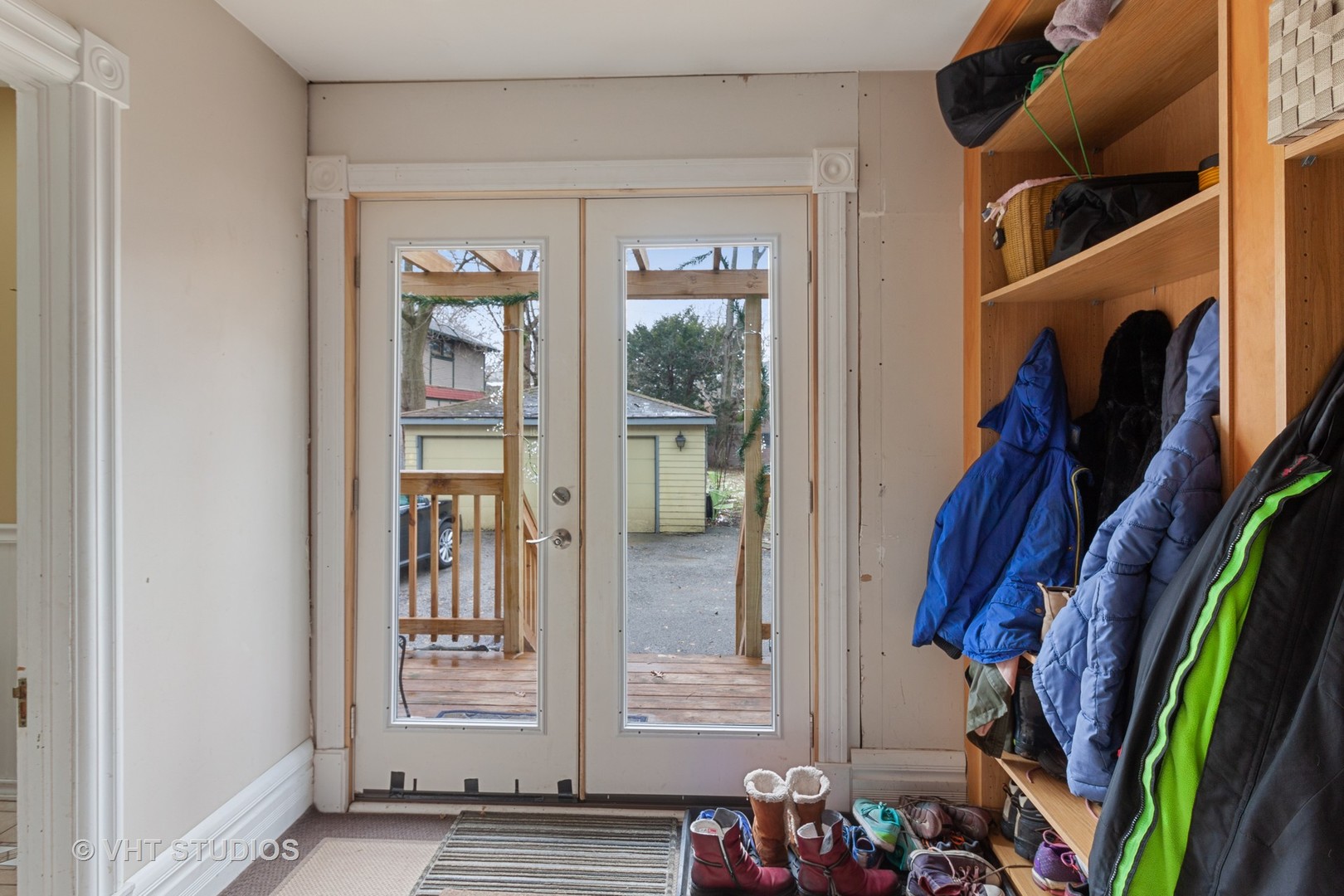 136 Scottswood Road Riverside, IL 60546 - Photo 8 of 20 a view of walk in closet with clothes and shoes