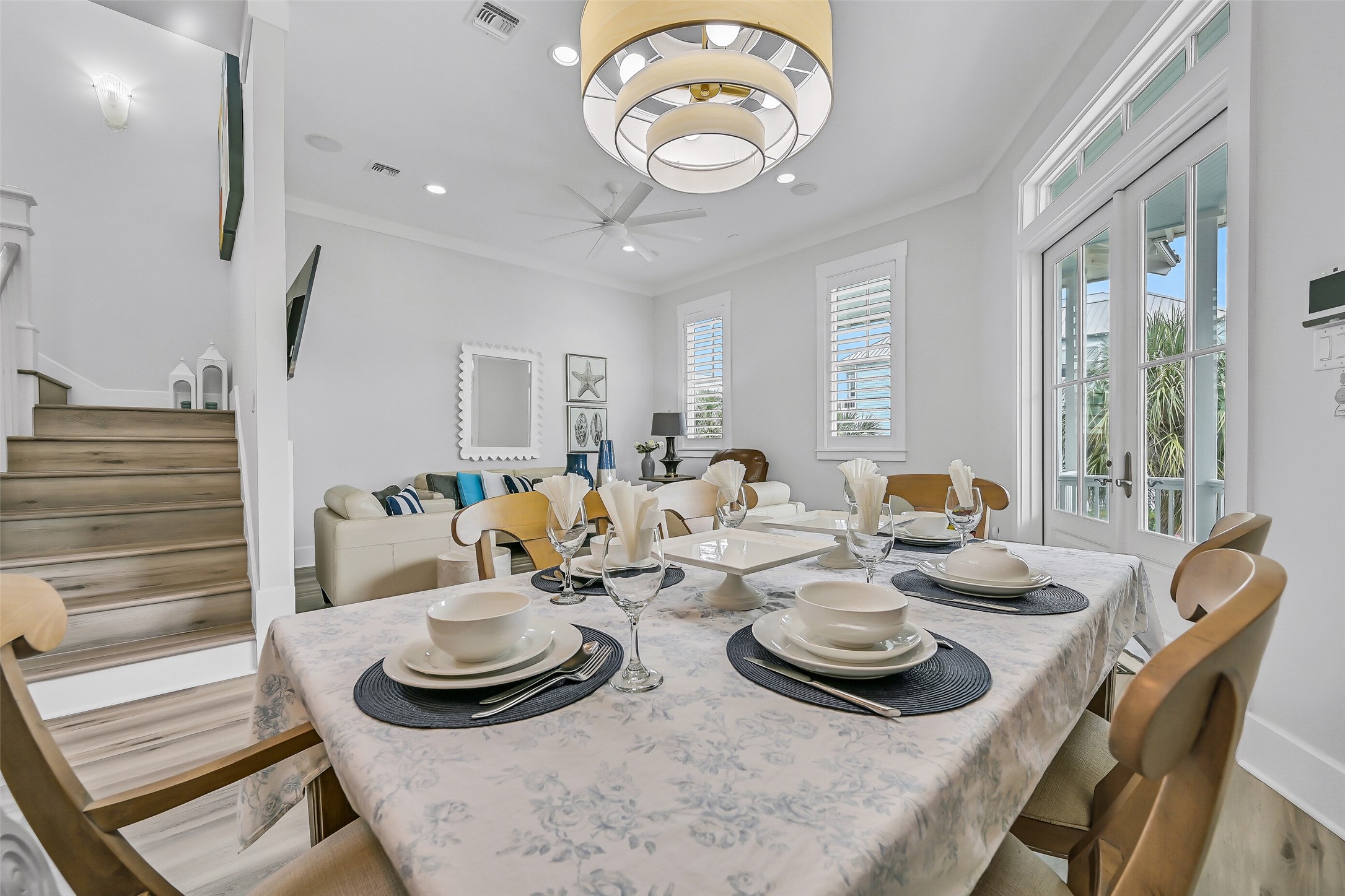 817 Positano Road Galveston, TX 77550 - Photo 20 of 50 Whether hosting a family dinner or enjoying a quiet evening in, this thoughtfully designed space brings comfort and elegance together. New beach-inspired flooring and seamless connection to the living and kitchen areas make every gathering feel effortless.