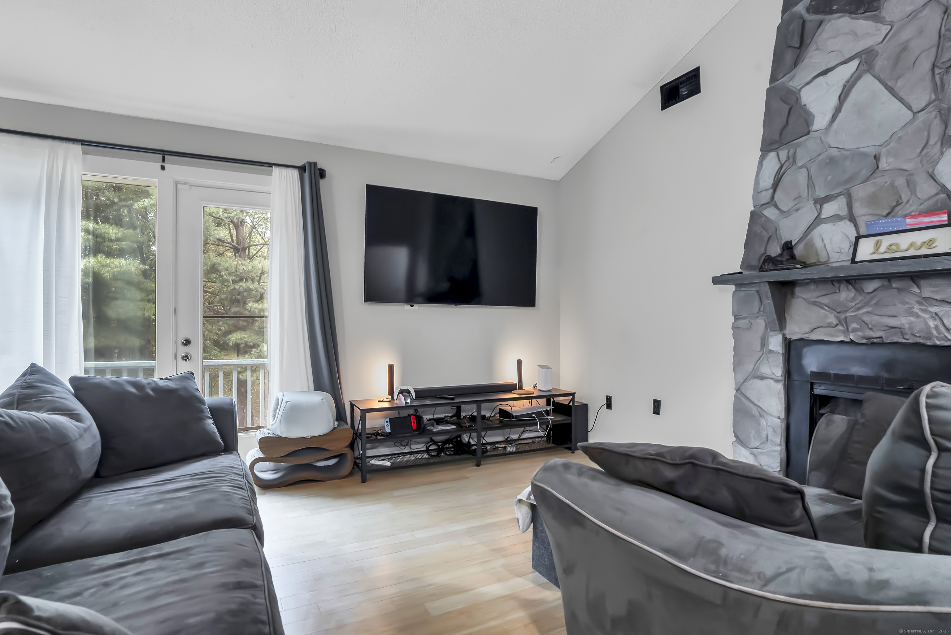 751 West Main Street, Unit G Cheshire, CT 06410 - Photo 11 of 38 a living room with furniture and a flat screen tv