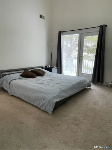 a house with a yard and a large tree