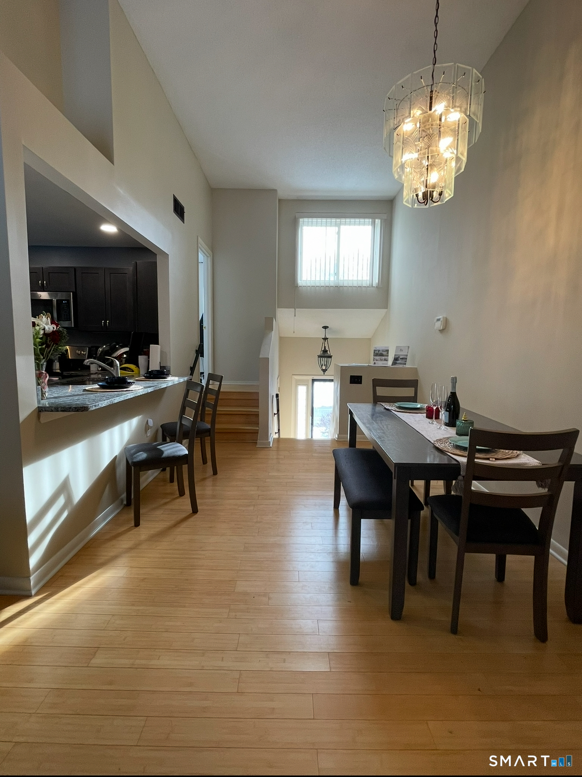 751 West Main Street, Unit G Cheshire, CT 06410 - Photo 5 of 38 a view of a dining room with furniture and chandelier