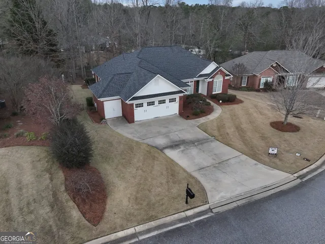 an aerial view of a house with a ocean view