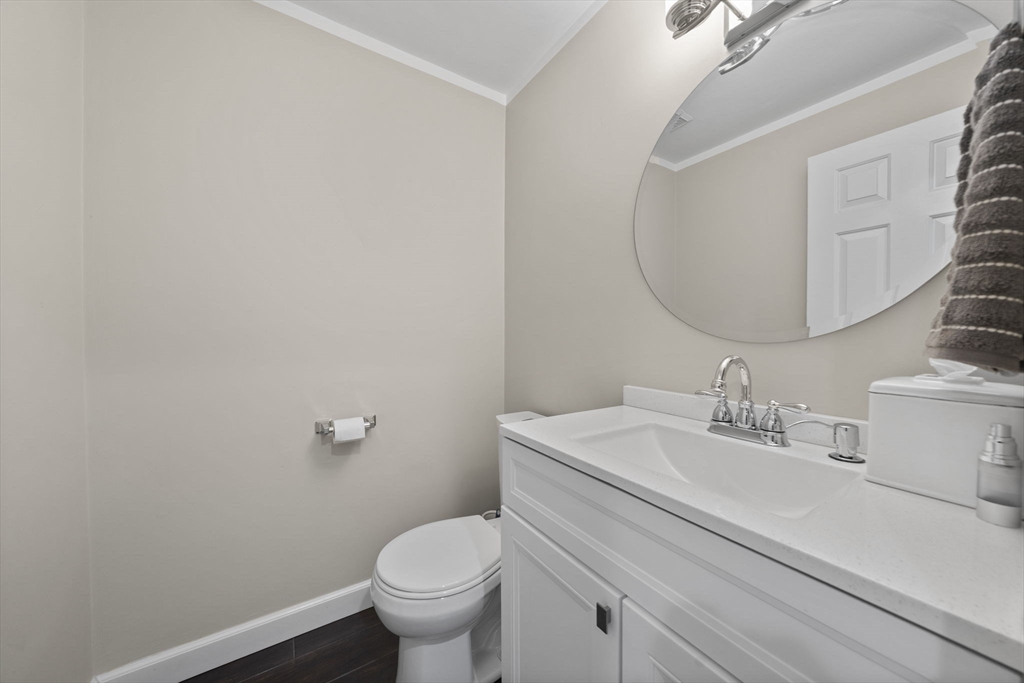 4 F Franklin Square, Unit 4F Randolph, MA 02368 - Photo 12 of 26 a bathroom with a sink mirror and toilet