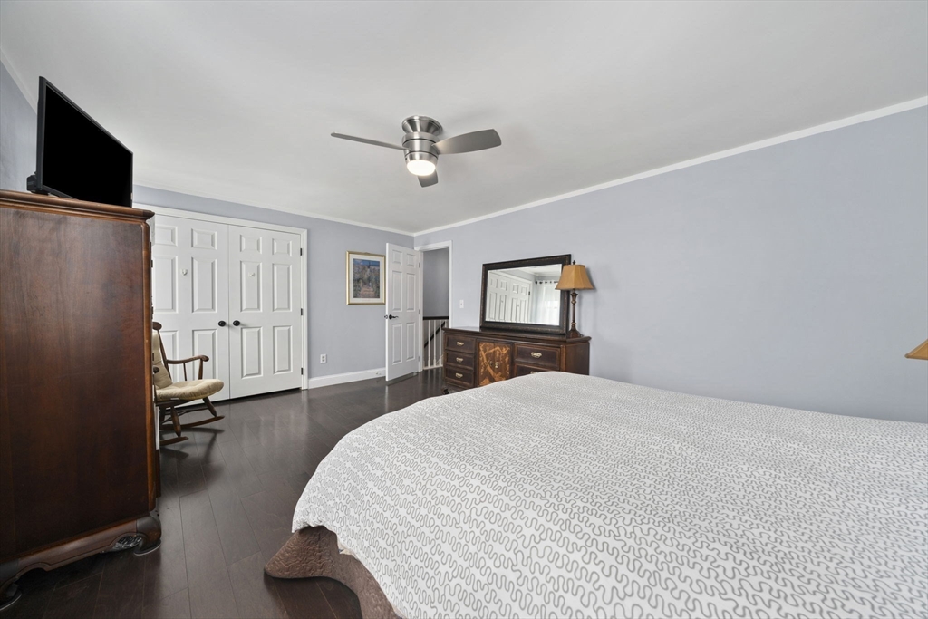4 F Franklin Square, Unit 4F Randolph, MA 02368 - Photo 20 of 26 a bedroom with a bed and a flat screen tv
