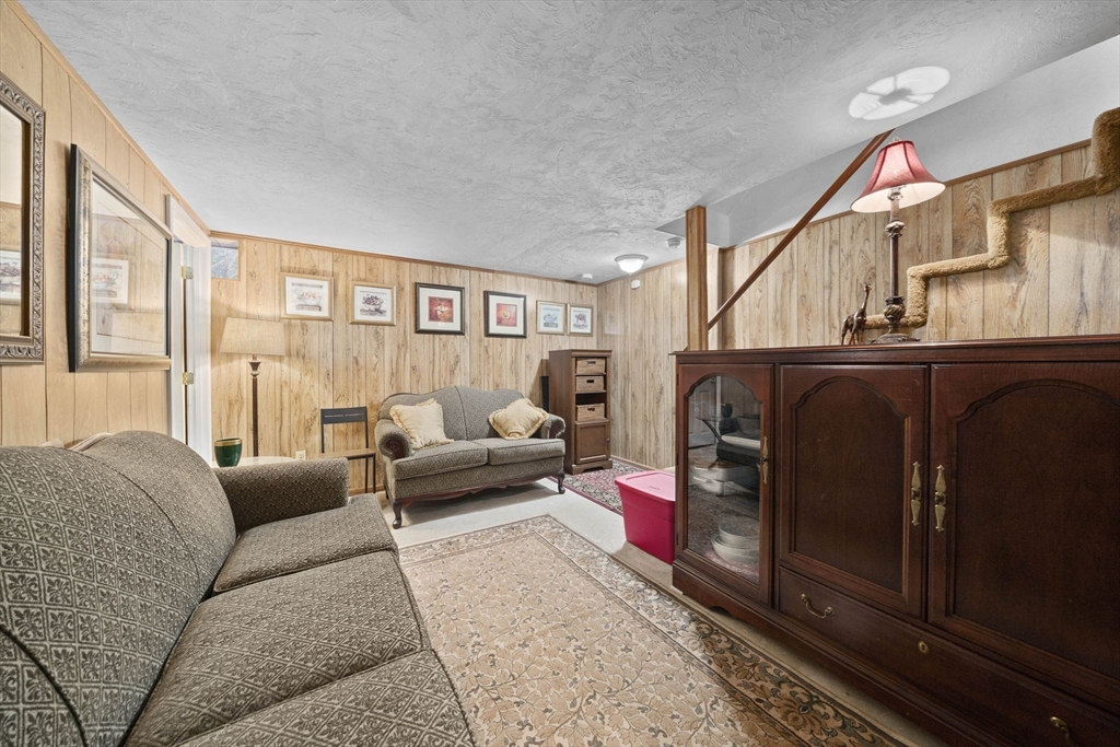 4 F Franklin Square, Unit 4F Randolph, MA 02368 - Photo 22 of 26 a living room with furniture and a fireplace