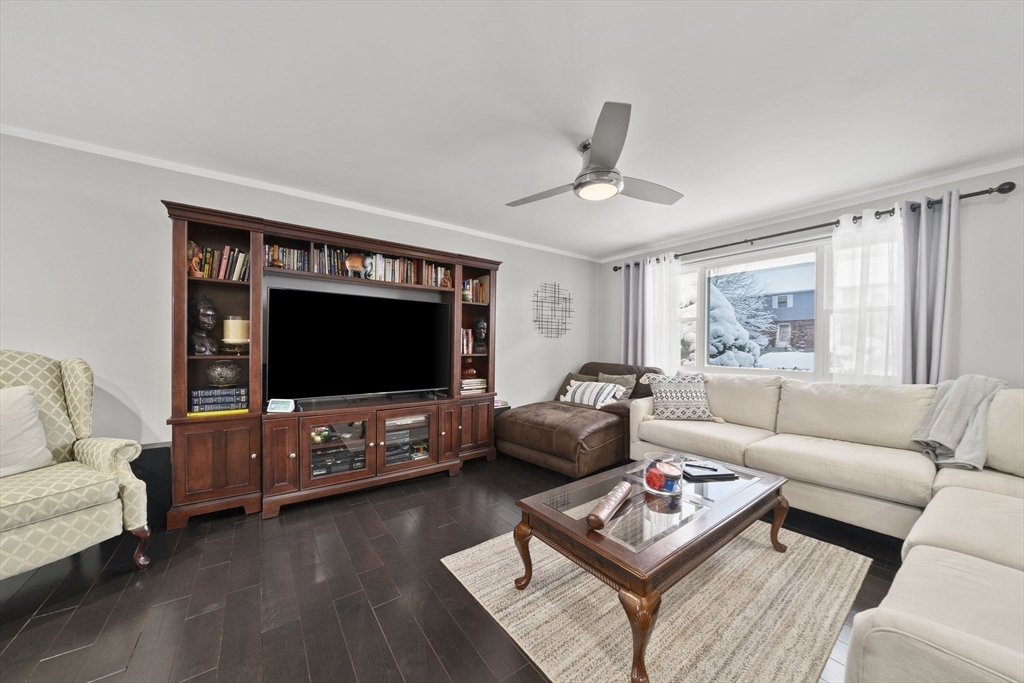 4 F Franklin Square, Unit 4F Randolph, MA 02368 - Photo 6 of 26 a living room with furniture and a flat screen tv