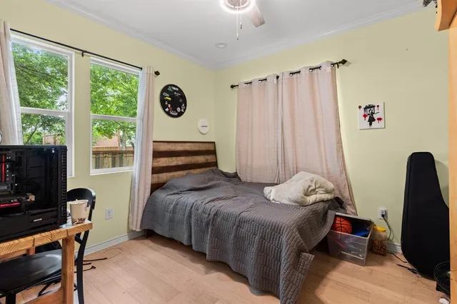 a bedroom with a bed and a window