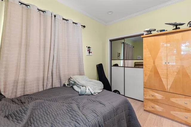 a bedroom with a bed and furniture