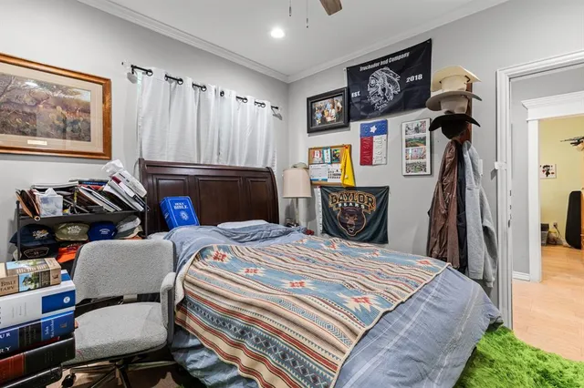 a bed room with a bed and a chair