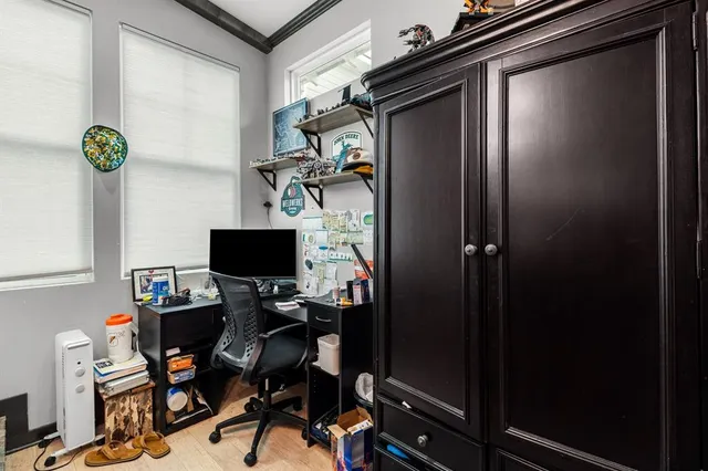 a backyard of a house with barbeque oven table and chairs
