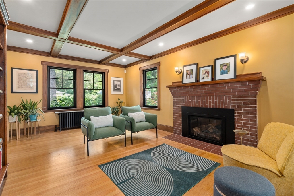 76 Cliff Road Milton, MA 02186 - Photo 5 of 36 a living room with furniture and a fireplace