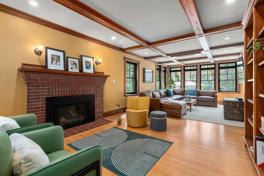 76 Cliff Road Milton, MA 02186 - Photo 6 of 36 a living room with furniture and a fireplace
