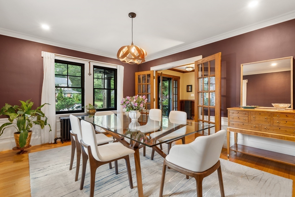 76 Cliff Road Milton, MA 02186 - Photo 9 of 36 a view of a dining room with furniture window and wooden floor