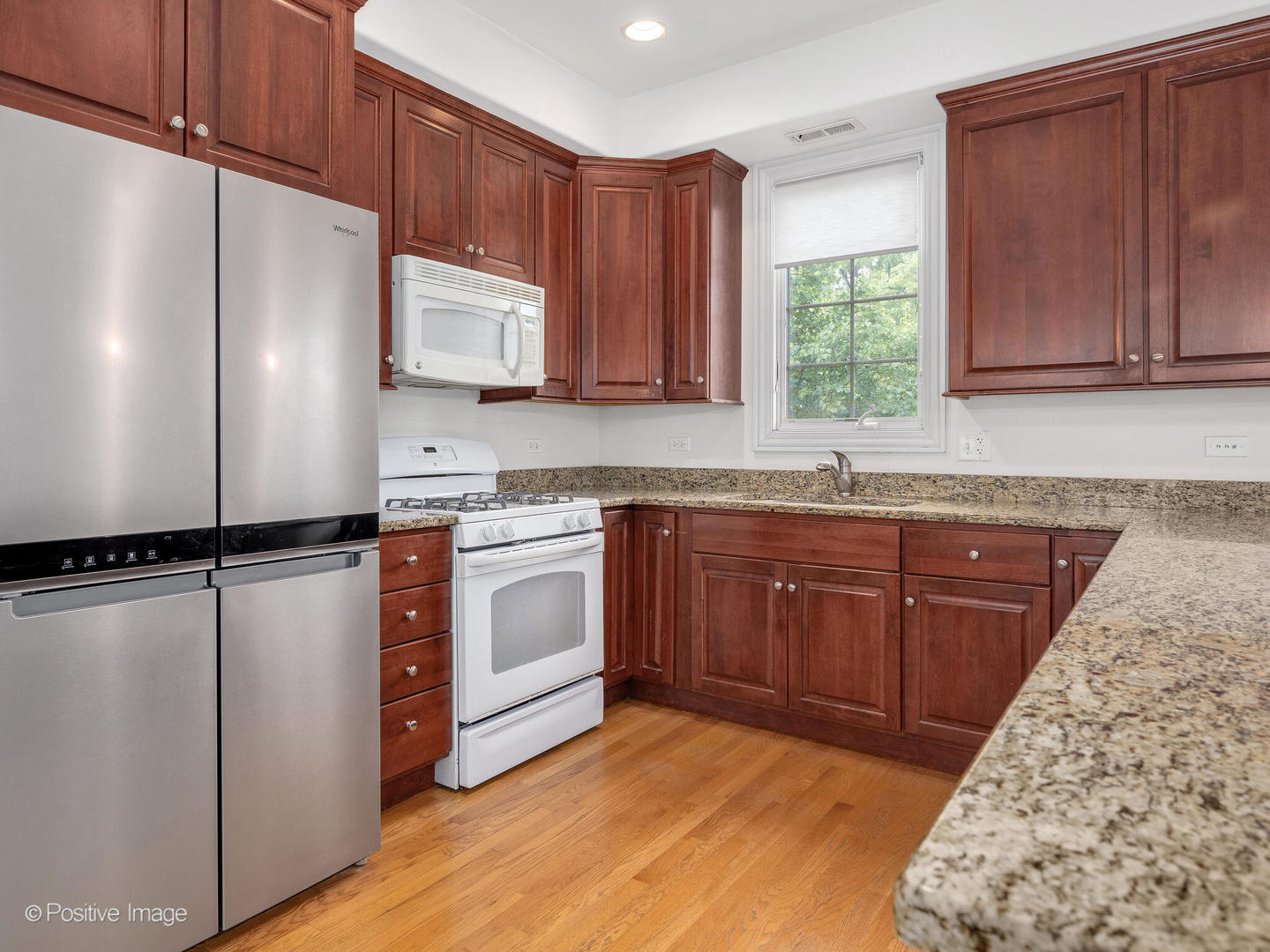 4313 Eberly Avenue Brookfield, IL 60513 - Photo 11 of 22 a kitchen with a refrigerator sink and cabinets
