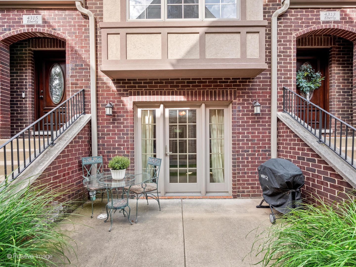 4313 Eberly Avenue Brookfield, IL 60513 - Photo 4 of 22 a front view of a house with outdoor seating and a window