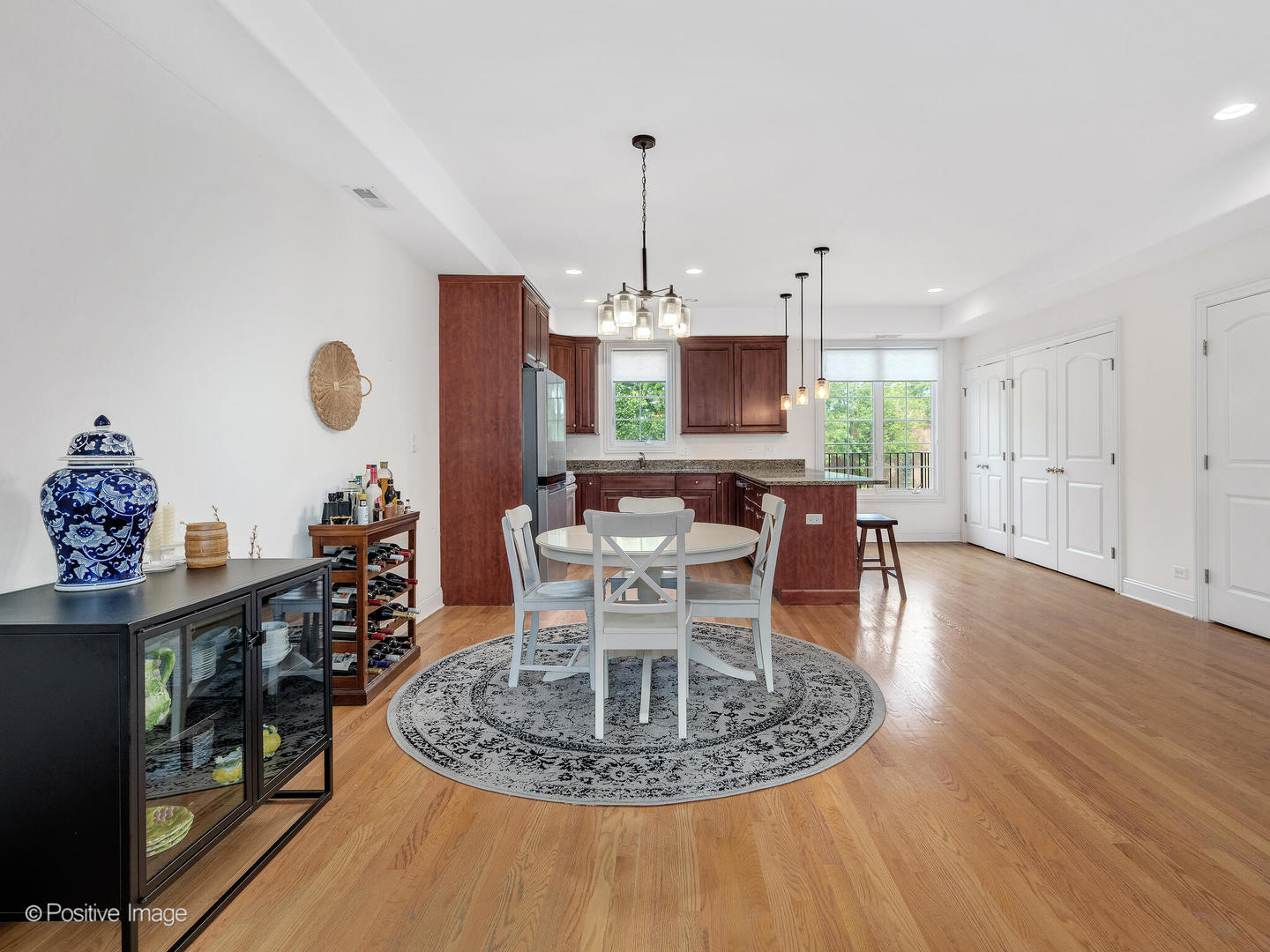 4313 Eberly Avenue Brookfield, IL 60513 - Photo 8 of 22 a dining room with furniture a chandelier and wooden floor