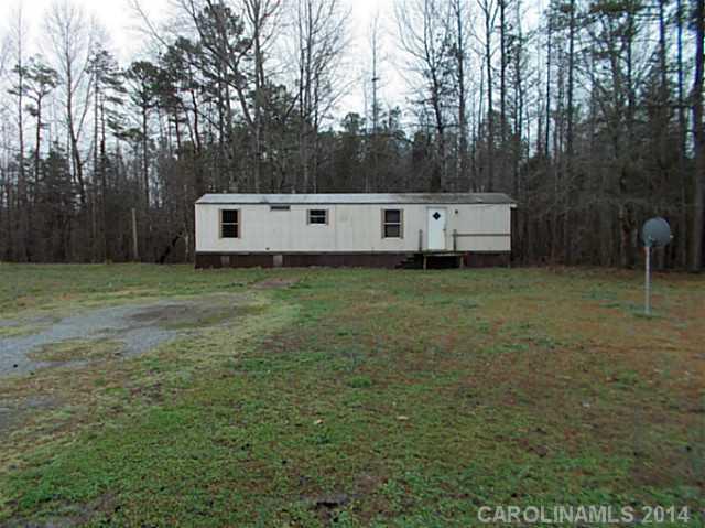 850 Cedar Grove Road Clover, SC 29710 - Photo 1 of 5 a backyard of a house with table and chairs
