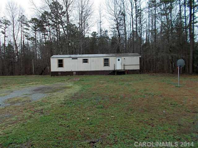850 Cedar Grove Road Clover, SC 29710 - Photo 3 of 5 a backyard of a house with table and chairs