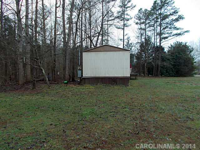 850 Cedar Grove Road Clover, SC 29710 - Photo 4 of 5 a view of a barn with a yard and large trees