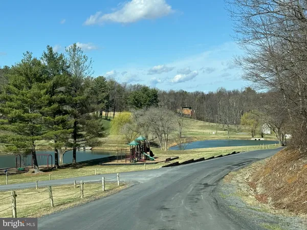 a view of a swimming pool with an outdoor seating