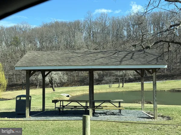a view of a swimming pool with an outdoor seating