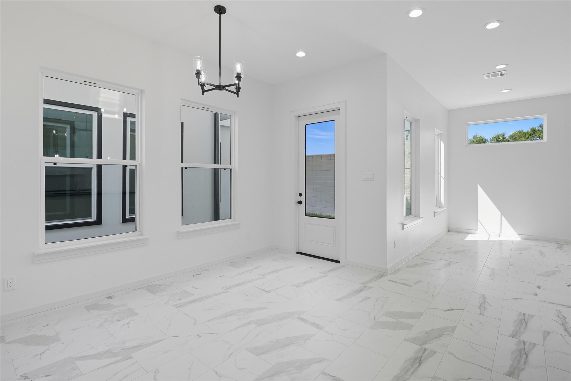 2924 El Fenice Lane Houston, TX 77057 - Photo 12 of 39 a view of a hallway with chandelier and entryway