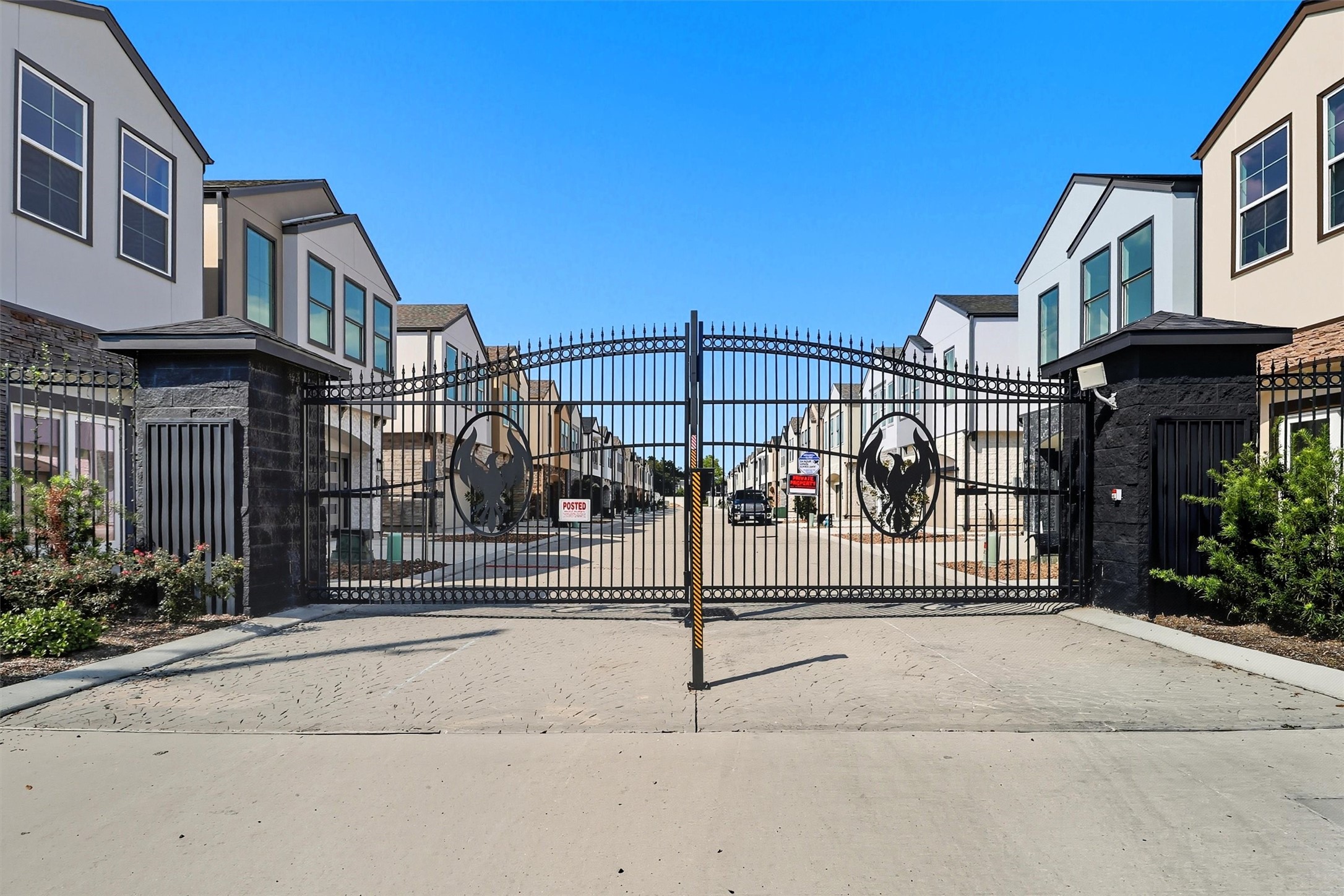 2924 El Fenice Lane Houston, TX 77057 - Photo 2 of 39 As you enter the gated community,
you’re welcomed by a beautifully
stamped concrete driveway and an
elegant gated entrance featuring the
community’s engraved logo, offering
a sense of security and
sophistication.