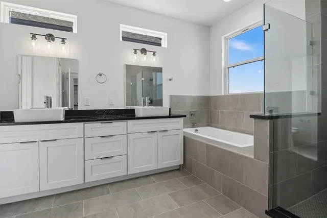 an empty room with windows and cabinet