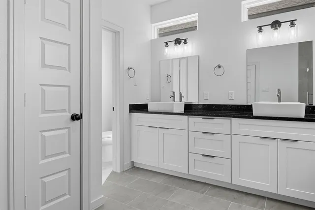 a bathroom with a sink a toilet and bathtub